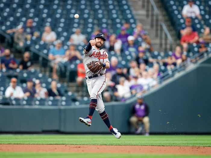 Sep 2, 2021; Denver, Colorado, USA; Atlanta Braves shortstop Dansby Swanson (7) throws to first base to retire a Colorado Rockies runner in the first inning at Coors Field.